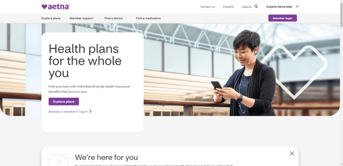 On the Individual Family plans page for Aetna, there’s an image of a woman smiling as she looks down at her phone. While the photo has a natural background, there’s also a white heart shape that has been added to the background. It’s the same shape as the Aetna heart logo.
