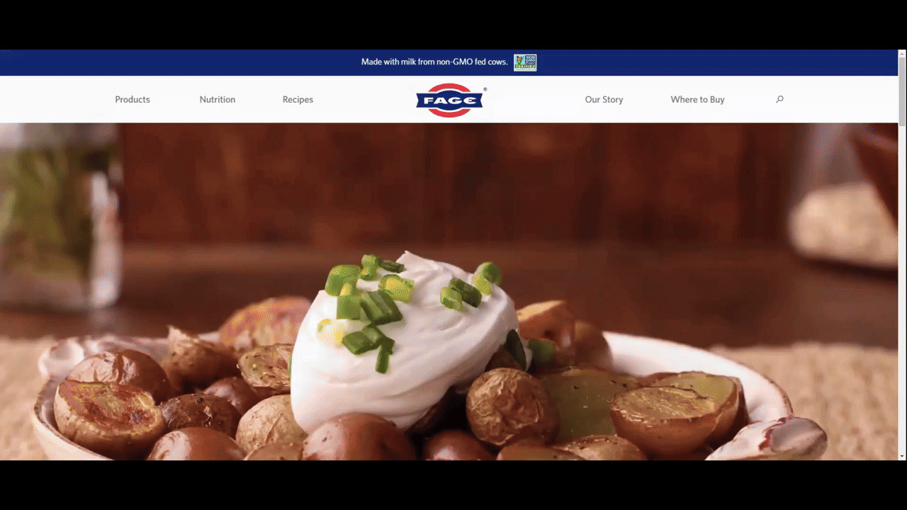 In this GIF, we see the hero section of the FAGE USA website in English. After the user scrolls to the bottom, opens the location switcher, and selects Greece, the page is translated into Greek.