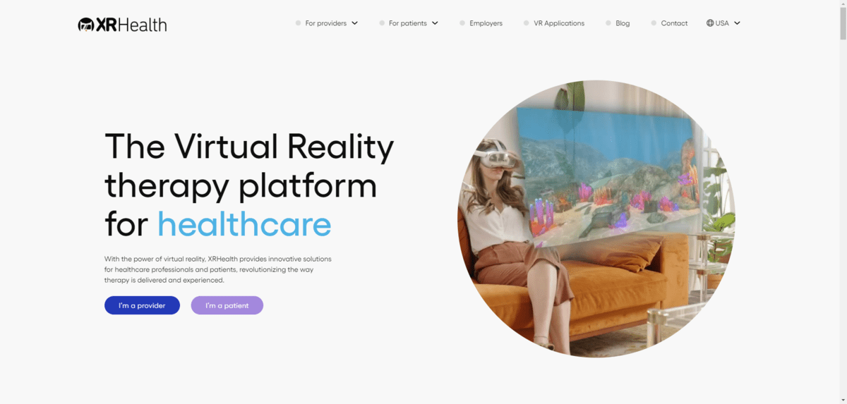 The XRHealth home page. We see a woman sitting on a couch wearing a VR headset, looking at a serene landscape. To the left, the text reads: “The Virtual Reality therapy platform for healthcare”.